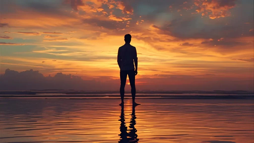 Pessoa contemplando a natureza ao amanhecer, transmitindo tranquilidade e paz interior.